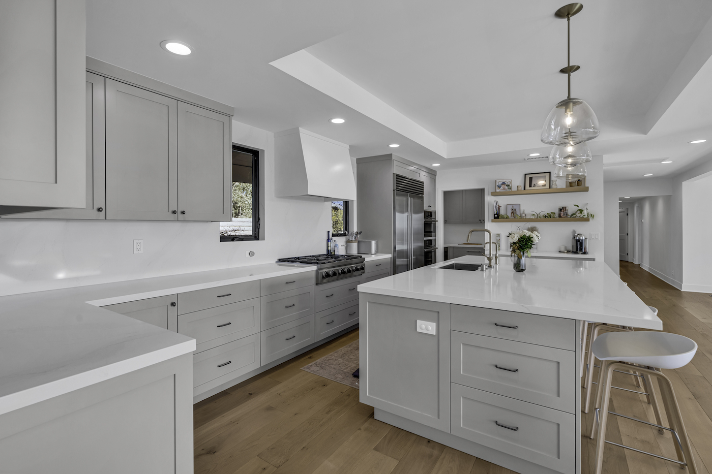 Equestrian Drive home renovation photo 6 — master bathroom with frameless glass shower in Orange County