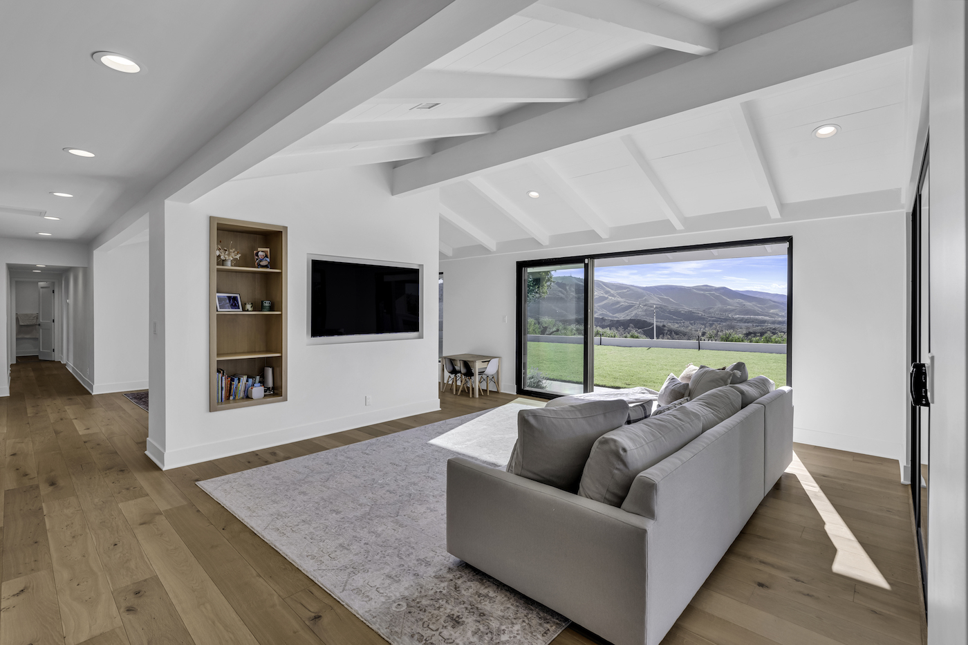 Equestrian Drive home renovation photo 8 — walk-in shower detail with linear drain and niche