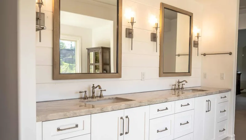 Bathroom interior with two framed mirrors and a double vanity