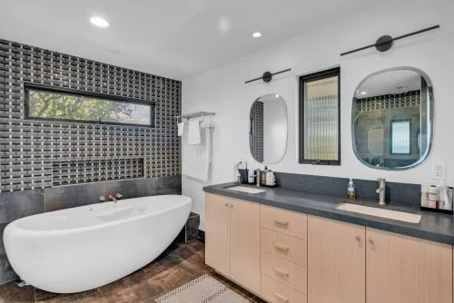 Custom bathroom tile work and frameless shower in Santa Ana, Orange County