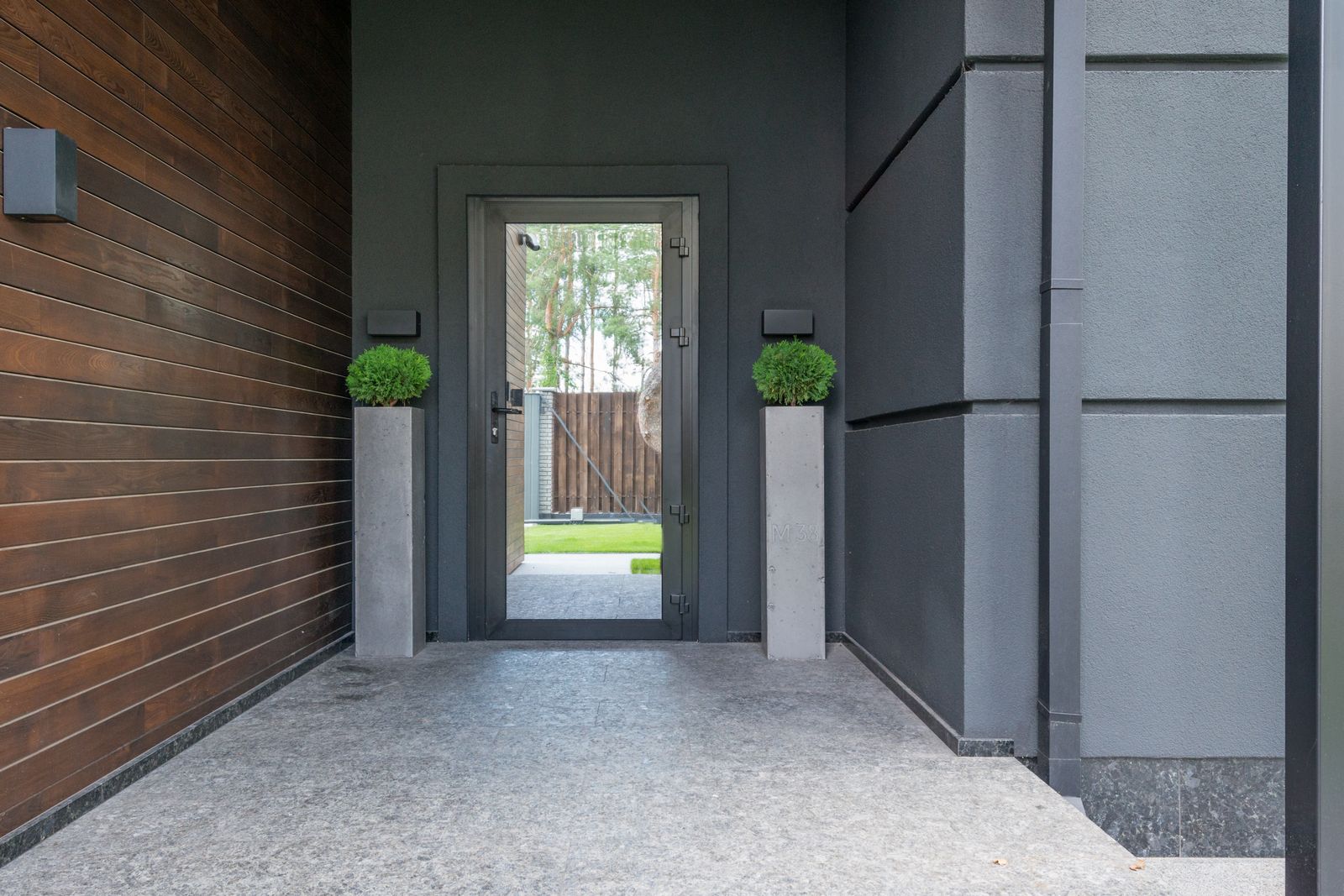 Contemporary front entry with a glass door, illustrative photo